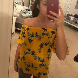 Bright yellow off the shoulder shirt with flowers